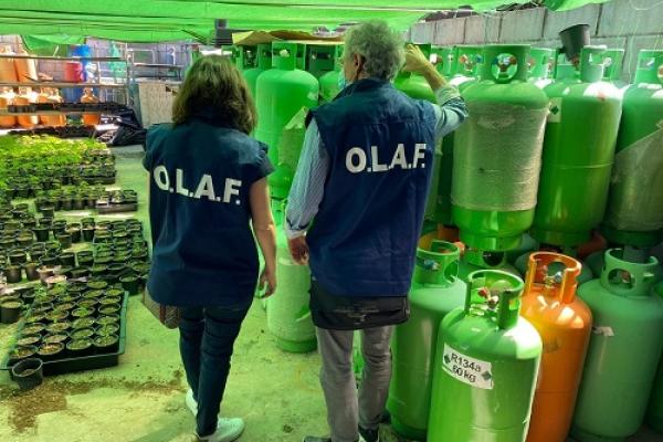 OLAF investigators looking at bottles of gas